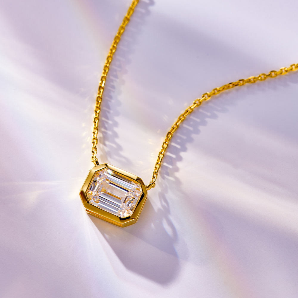 Radiant cut gold tone pendant necklace.