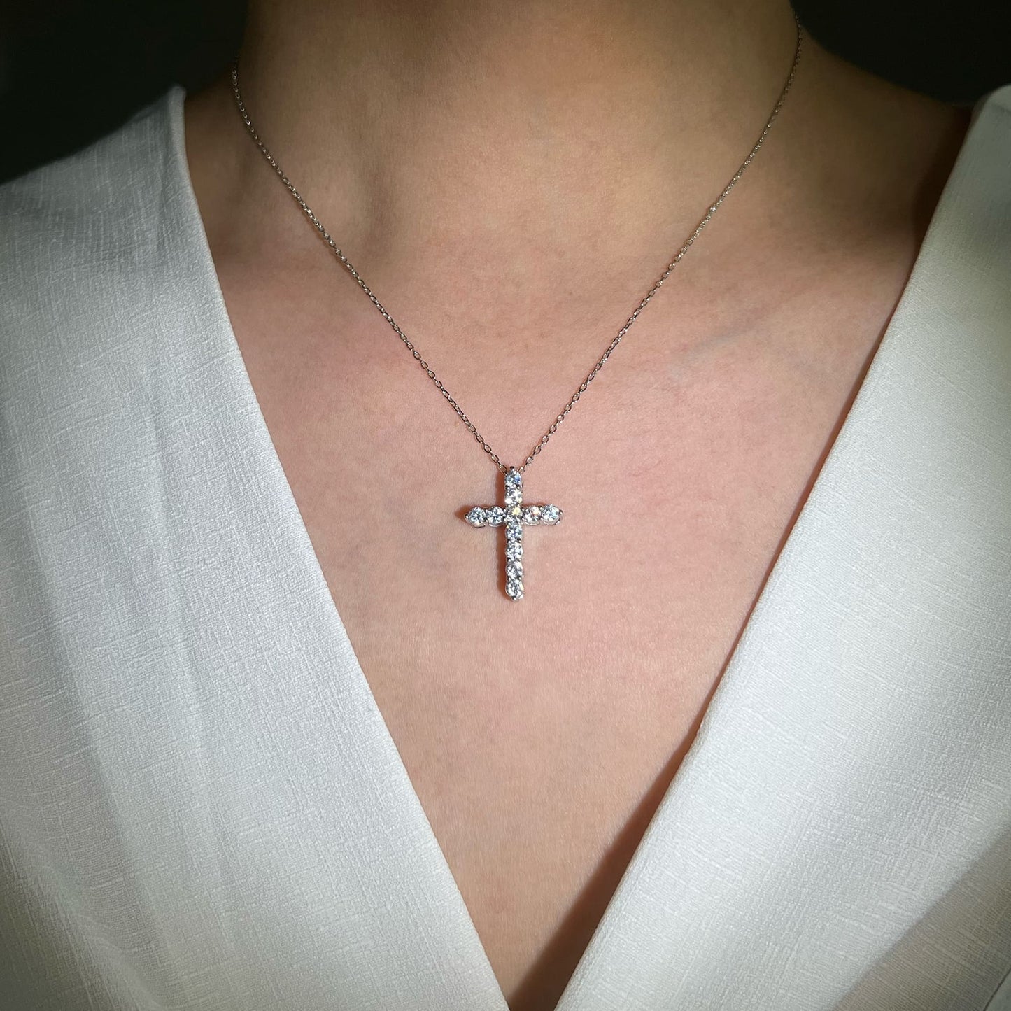 Model showcasing chic style with Cross Pendant Necklace adorned with simulated diamonds - Effortlessly radiant and perfect for layering to achieve a fashionable look.