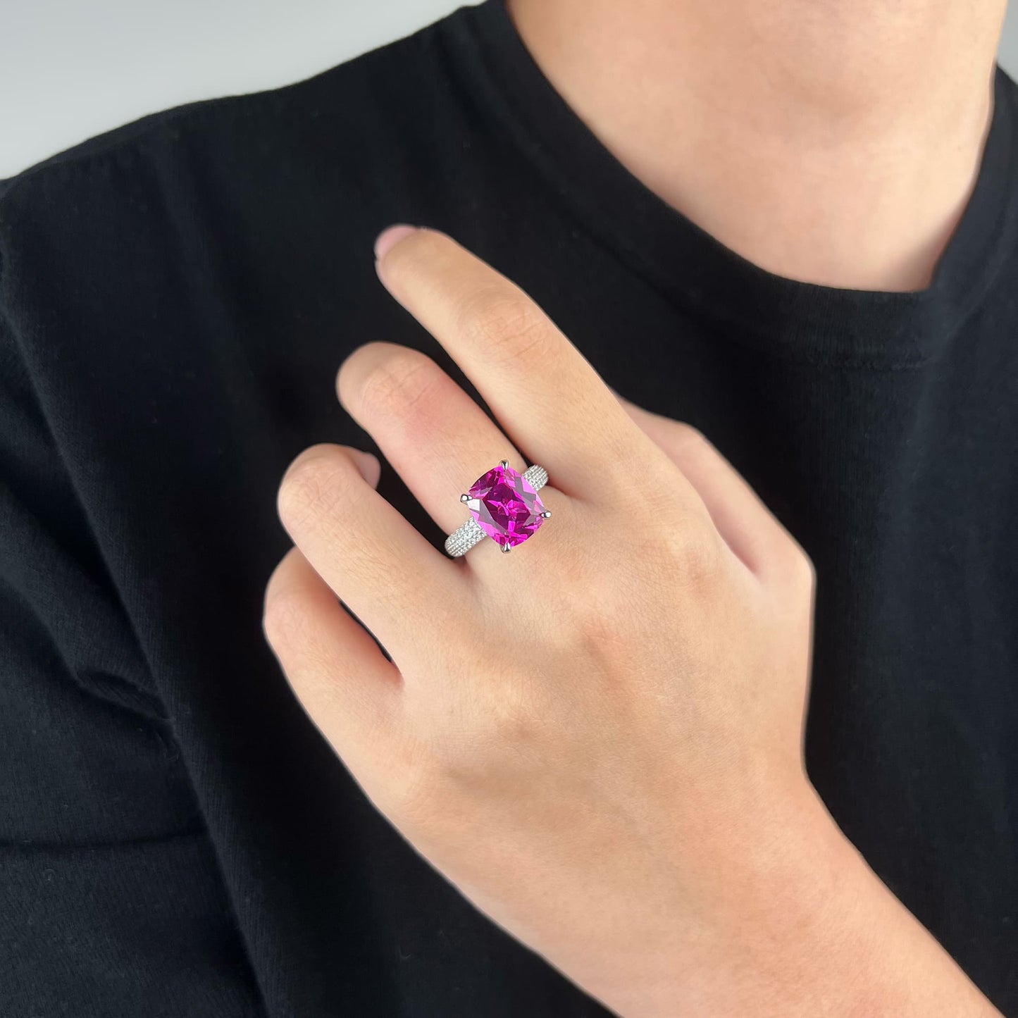 Model wearing the Empress Pink Radiance Ring - A bold statement piece with a 7.37-carat main stone, its vibrant pink hue exhibits a strikingly beautiful effect, making it perfect for daily wear or commanding attention with any outfit.