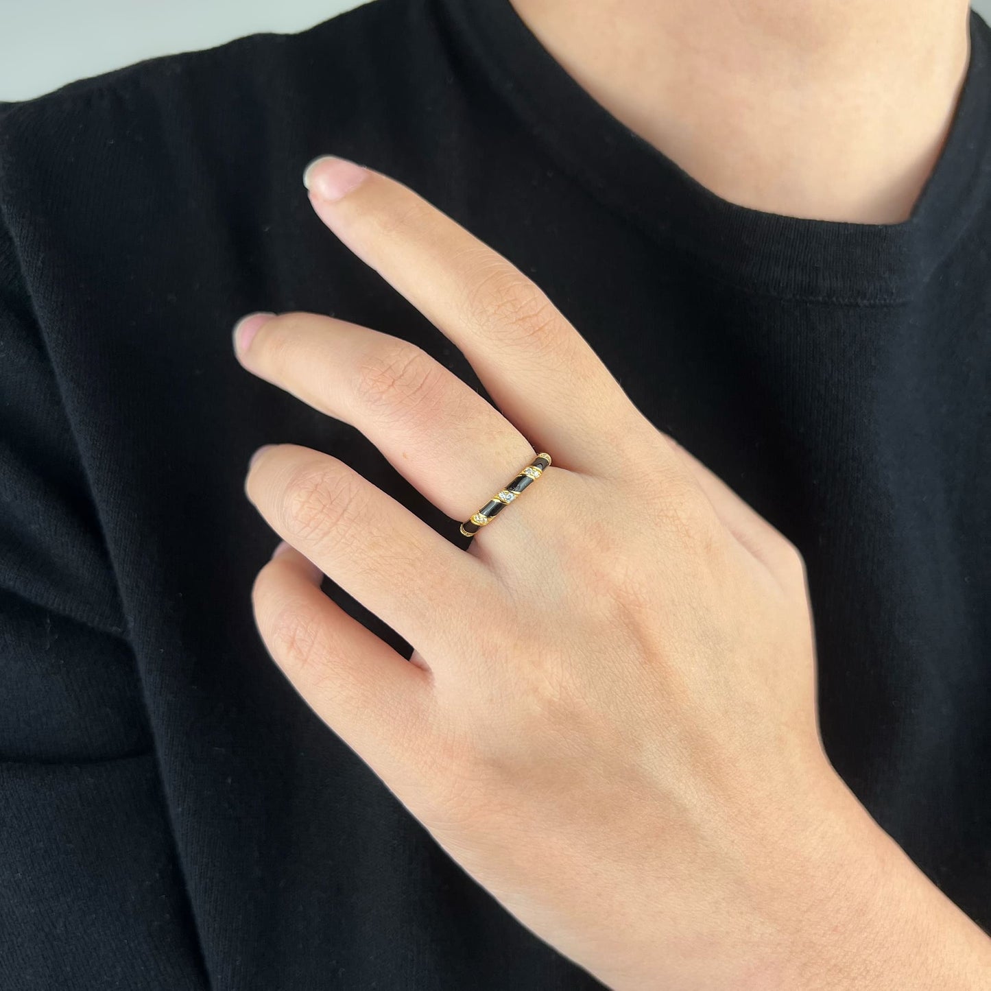 Model adorned with the Enamel Spiral Ring - A seamless transition from casual elegance to opulent glamour, showcasing the classic spiral design for versatile and stylish appeal.