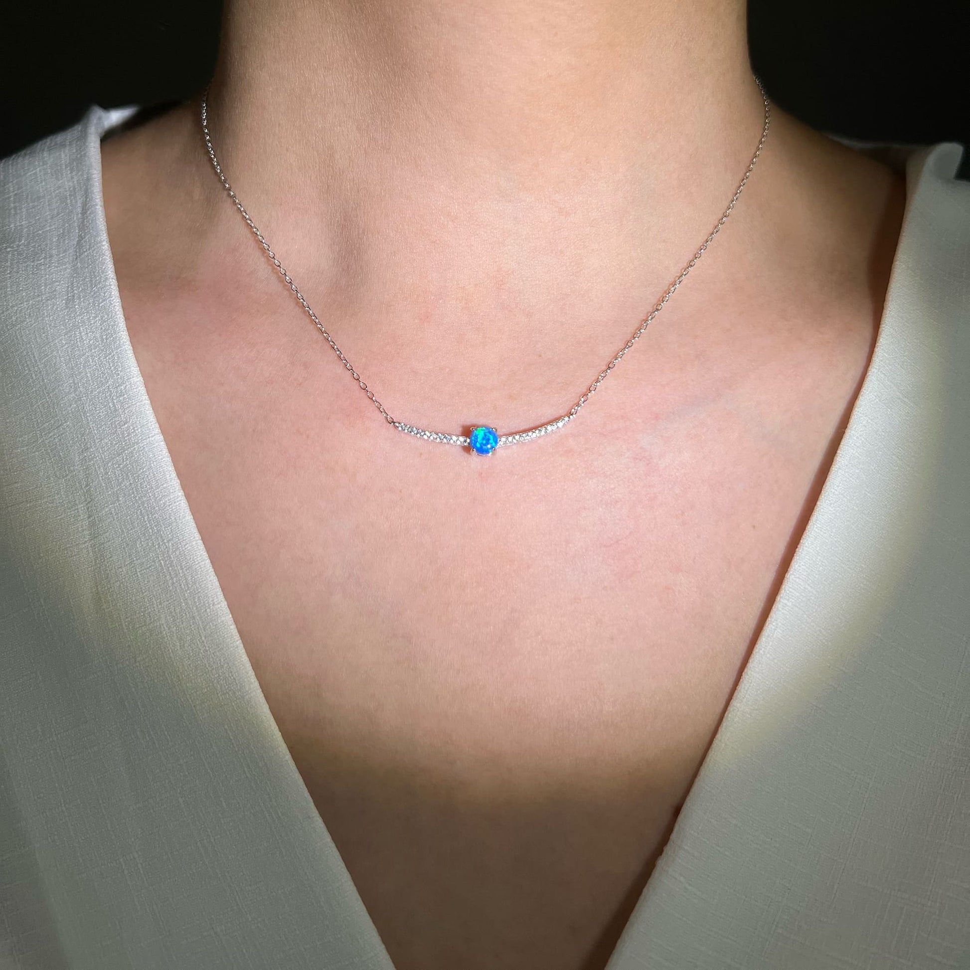 Model adorned with the Galaxy Blue Opal Necklace - Evoke feelings of clarity, communication, and emotional balance. A serene and uplifting accessory for inner harmony.