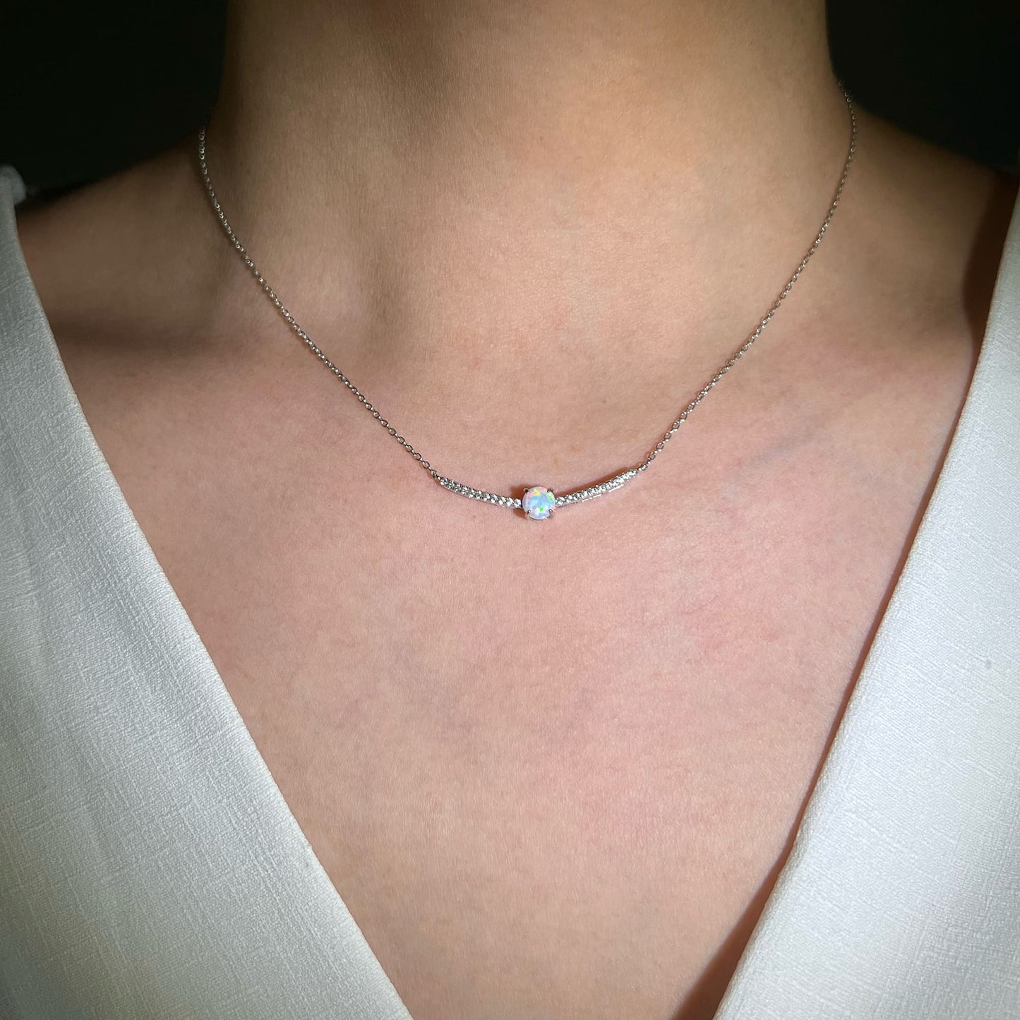 Model showcasing the Galaxy Milky White Opal Necklace - Experience tranquility and inner peace with the milky, iridescent appearance. A gentle and calming accessory for a serene, moonlit aesthetic.