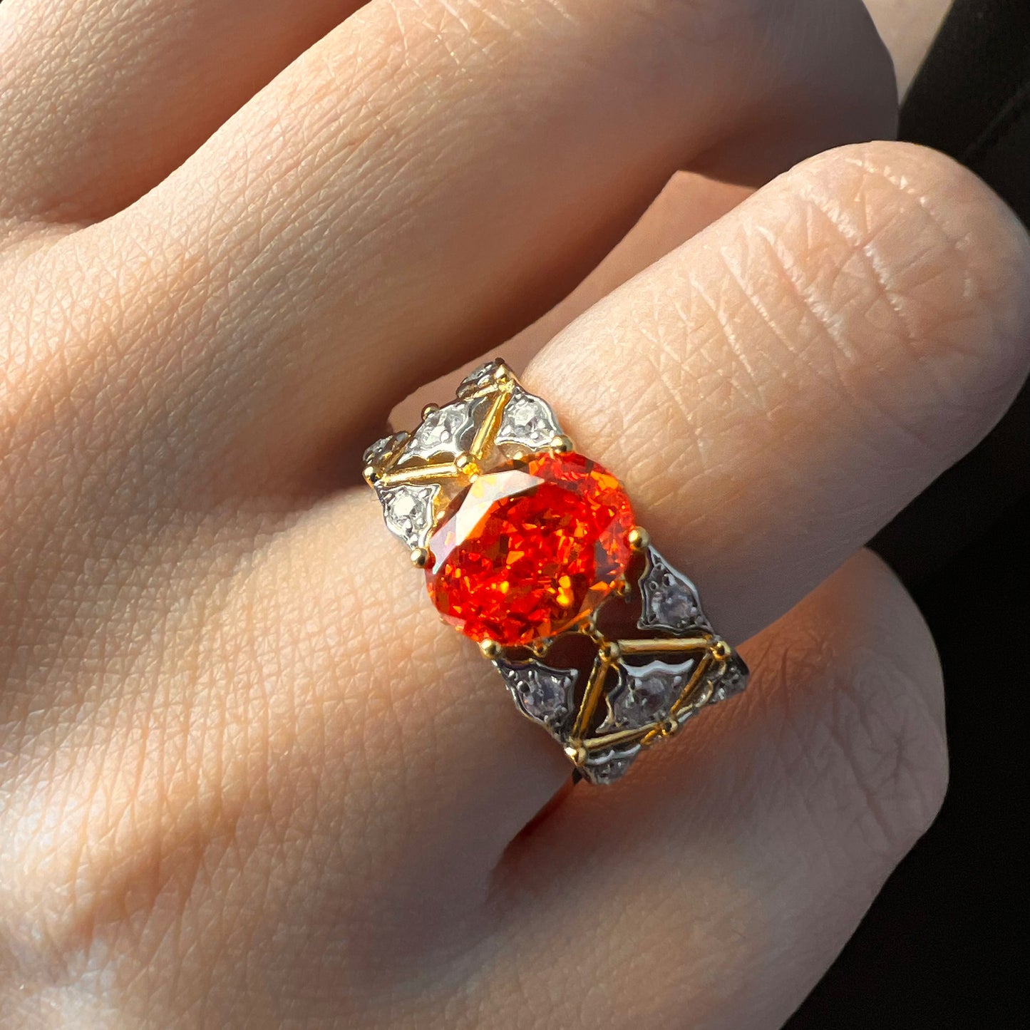 Model showcasing versatility: Radiant Ember Ring with dual-tone band, a perfect accessory for any occasion.