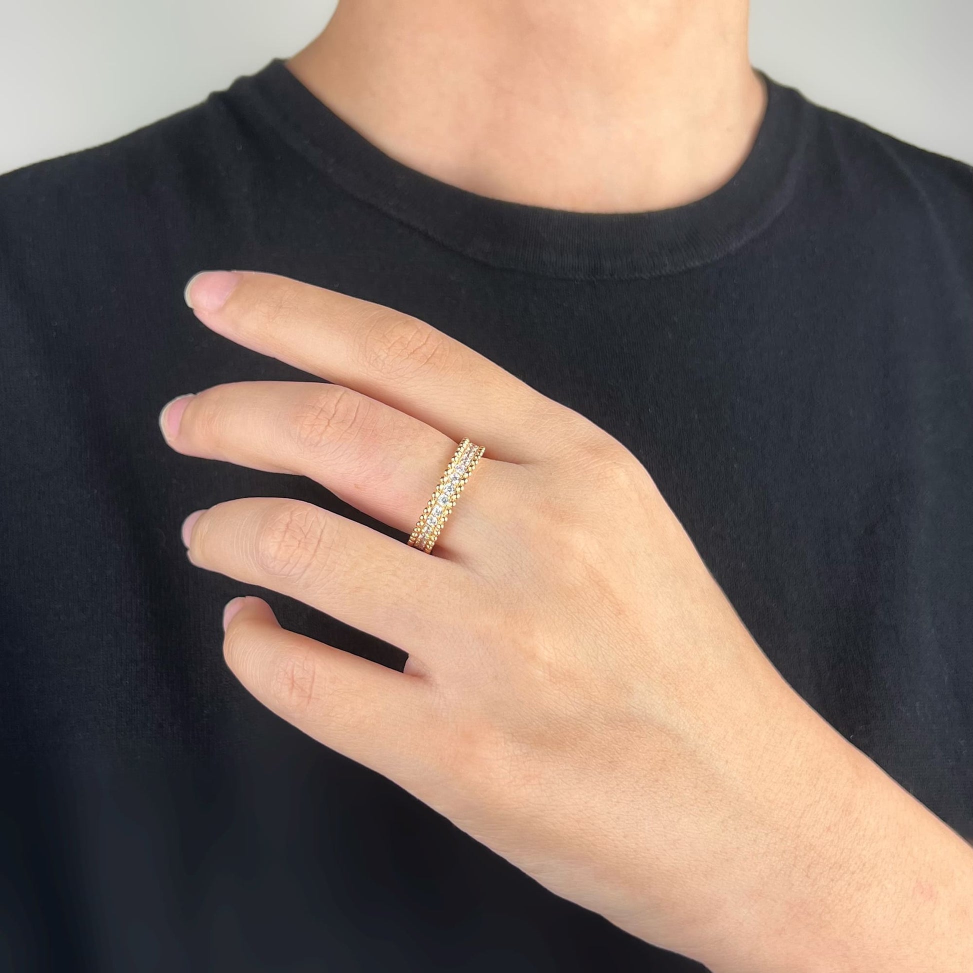 Model showcasing the Orbit Ring in Rose Gold - A symbol of timeless elegance adorned with hand-set simulated diamonds, exuding sophistication and allure.