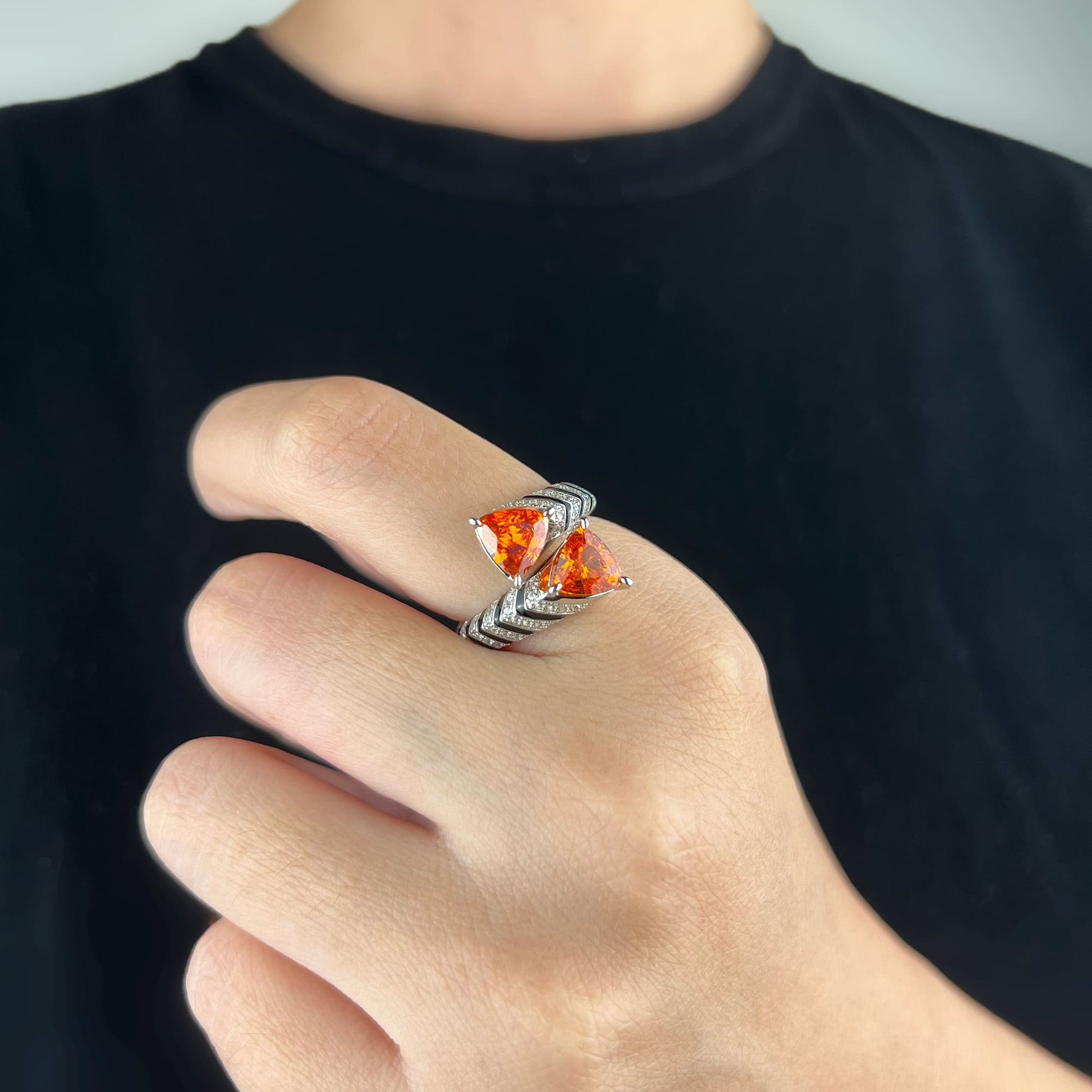 Close-up of Symmetry Statement Ring with precisely cut stones in a geometric framework