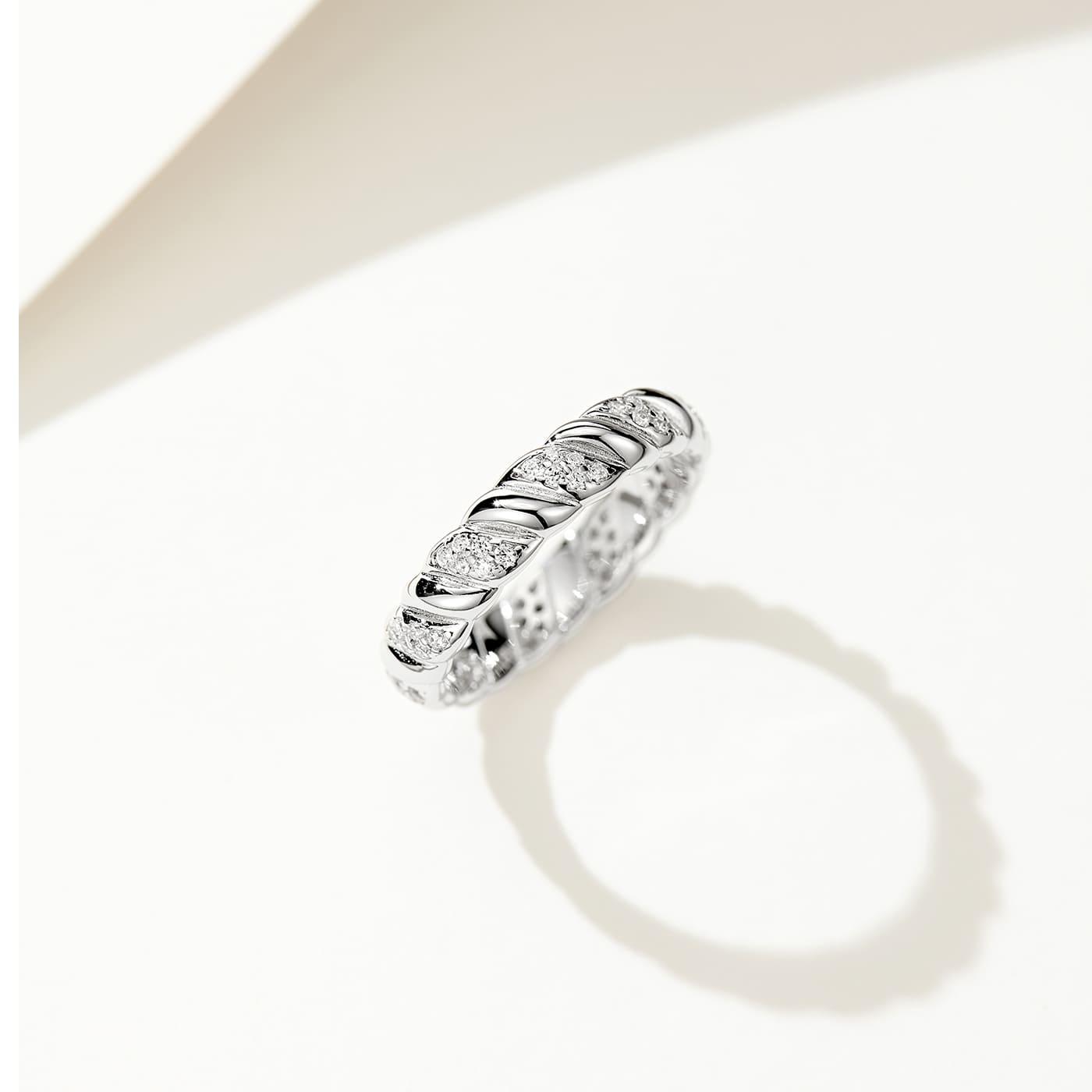 Detail shot showcasing the elegant simplicity and captivating twist design of our Half Pave Twisted Silver Ring.