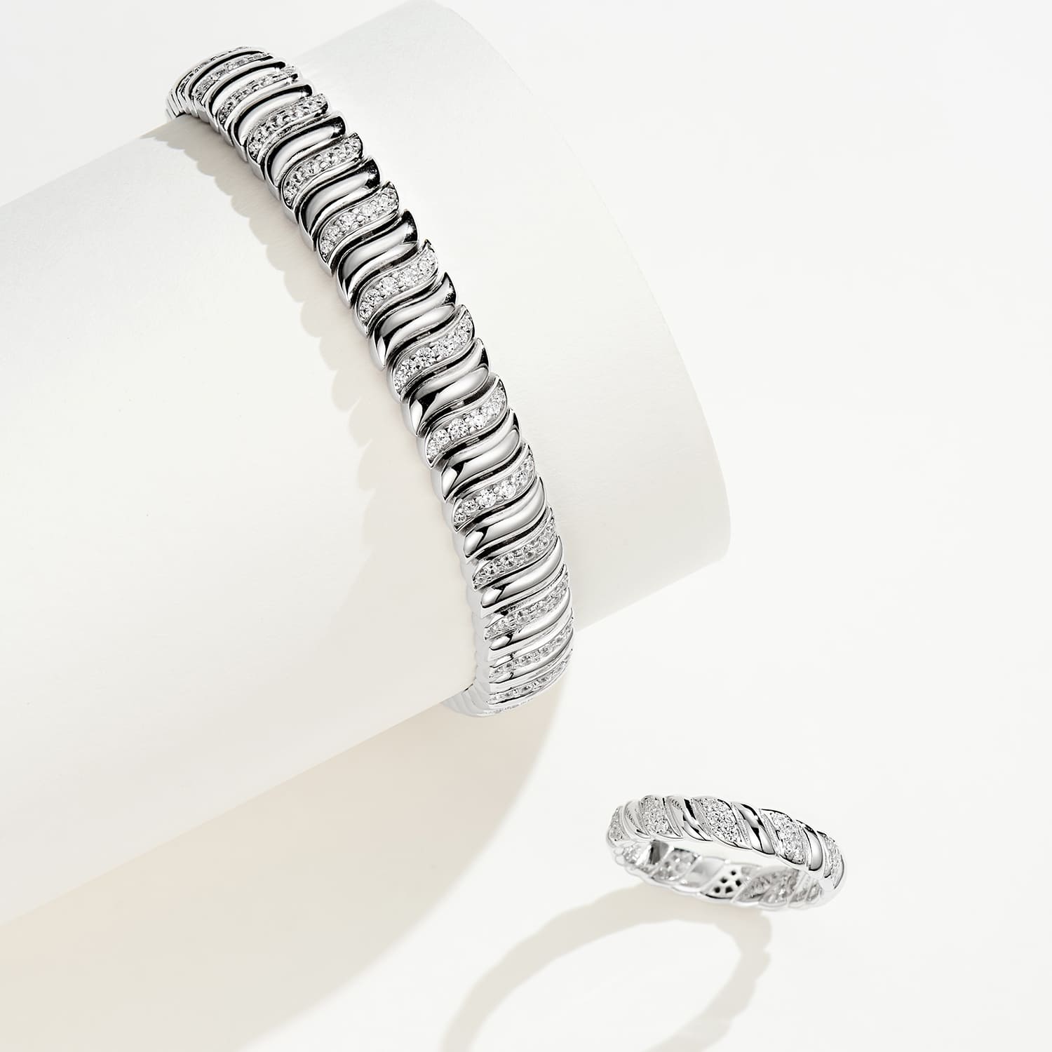 Stunning ensemble: Half Pave Twisted Silver Ring and matching bracelet in a captivating twist design.